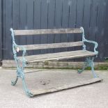 A slatted wooden garden bench, with painted ends,