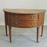 An early 20th century mahogany demi-lune chest,