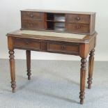 An early 20th century continental walnut desk, with a pull-out writing surface,