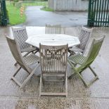 A teak garden table, of hexagonal shape, 111cm,