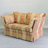 A red and gold striped upholstered knole sofa,