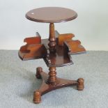 A Victorian style plum pudding mahogany book table, on turned feet,