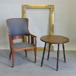 An Edwardian mahogany armchair, together with an oak coffee table,