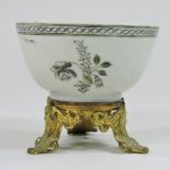 An 18th century Chinese teabowl, mounted on a continental gilt stand,