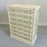 A cream and floral painted chest,
