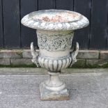 A Victorian white painted cast iron urn, with lion mask relief,