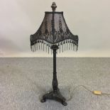 A black painted table lamp and shade,