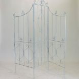 A blue painted metal three fold garden screen,