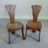 A pair of early 20th century oak hall chairs,