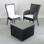 A set of eight black Lloyd Loom dining chairs, together with a matching coffee table,