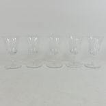 A set of five 19th century etched glass wine glasses,