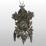 A 19th century Black Forest style cuckoo clock, the dial showing Roman numerals,