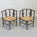 A pair of 19th century rush seated corner chairs