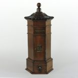 A Victorian style walnut country house letter box, the turned finial above carved leaf decoration,