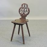 A 19th century Chamonix mahogany musical chair