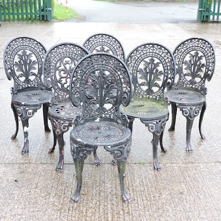 A set of six black painted aluminium garden chairs