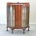 A 1930's bow front astragal glazed display cabinet,