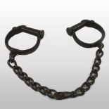 A set of 19th century iron shackles,