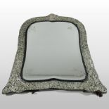 A large Victorian silver framed dressing table mirror, of cartouche shape,
