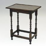 An 18th century oak occasional table, of rectangular form, on bobbin turned legs,