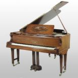 A German walnut cased baby grand piano, on square tapered legs, by R.