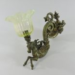 An ornate 19th century brass wall sconce, the scrolled support in the form of a horse,