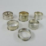 A collection of six various silver napkin rings,