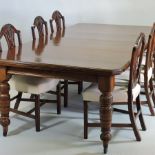 A Victorian walnut wind-out extending dining table, with two additional leaves, on turned legs,