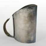 An Edwardian silver jug, of flattened oval shape, with a bound handle, Birmingham 1901,