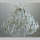 A 19th century style cut glass chandelier, with twelve branches,