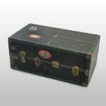 An early 20th century metal bound travelling trunk, the interior fitted with a wardrobe, by Schemen,