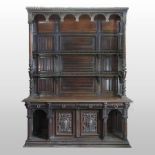 A 19th century continental carved walnut dresser, of large proportions,