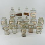 A collection of sixteen 19th century and later glass apothecary jars, of varied size and design,