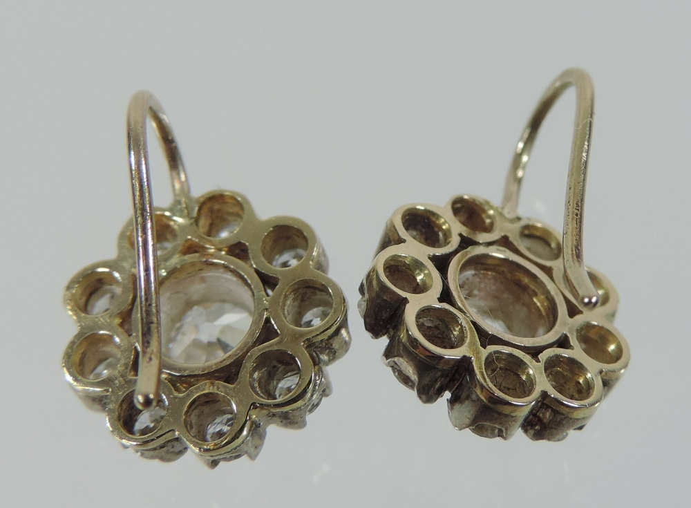 A pair of diamond cluster earrings, each central stone approximately . - Image 2 of 5