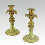 A pair of 19th century continental gilt metal and porcelain candlesticks,
