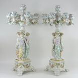 A pair of Meissen style floral encrusted porcelain candelabra,