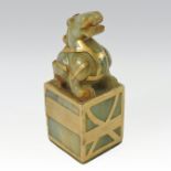 A Chinese jade and gilt painted seal, in the form of a dog of Fo,