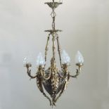 An ornate continental style brass six branch chandelier,