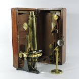 A 19th century brass monocular microscope, inscribed Smith & Beck, 6 Coleman St.