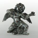 An Italian silver painted carved wooden figure of a cherub,