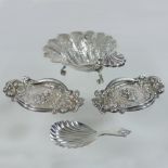 A modern silver shell shaped bon-bon dish, raised on three scrolled feet, Birmingham 1971, 13cm,