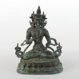 An Eastern bronze figure of a seated deity,