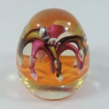 A Paul Ysart Harland glass 'Fountain' paperweight, with internal loops of pink and brown,