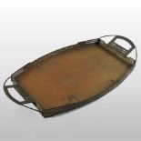 A Secessionist copper and brass serving tray, designed by Gustave Serrurier-Bovy, of oval shape,