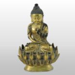 A Chinese gilt bronze figure of Buddha, seated on a lotus,