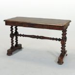 A Victorian walnut side table, of rectangular shape, on turned legs and a splayed base,