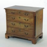 A George III mahogany chest, containing four long graduated drawers, on bracket feet,