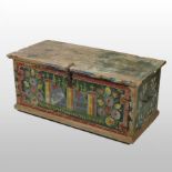 A 19th century continental painted pine blanket box, with a hinged lid,