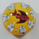 A Paul Ysart Harland glass paperweight, decorated with central lampwork fish,