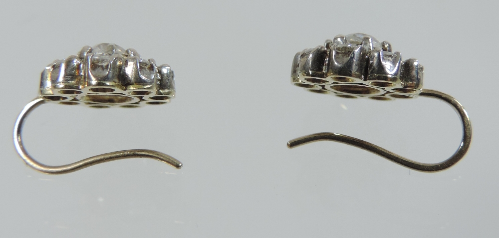 A pair of diamond cluster earrings, each central stone approximately . - Image 5 of 5